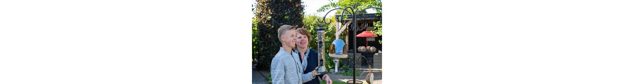 The Apollo feeder is attached to a pole system from which other feeders are also hung.